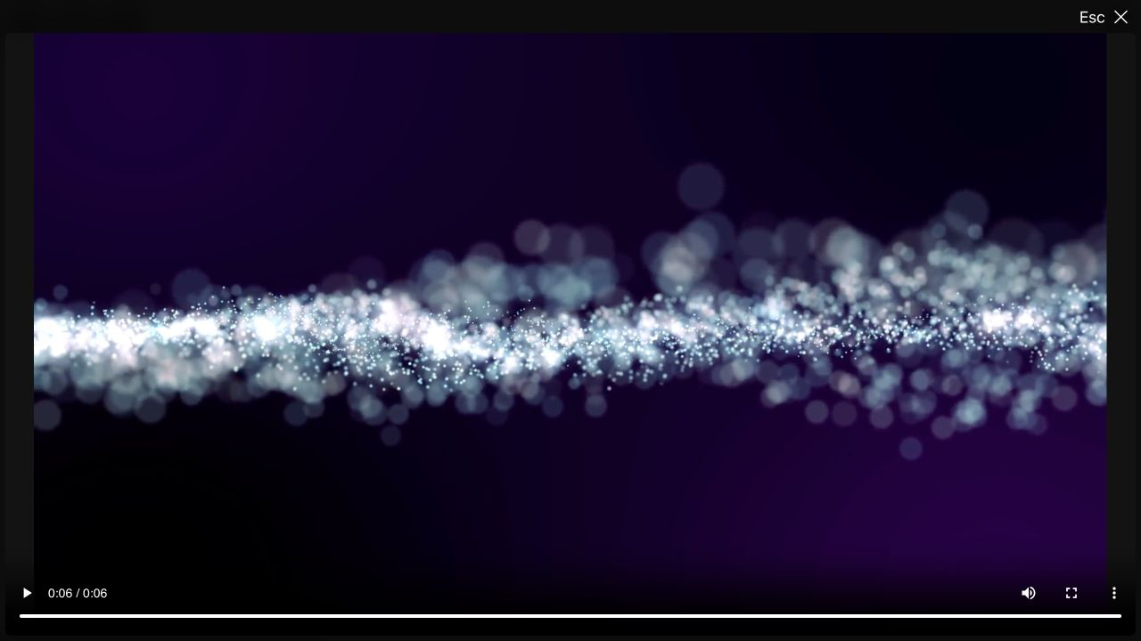 A video playing in a lightbox after being opened from a text block